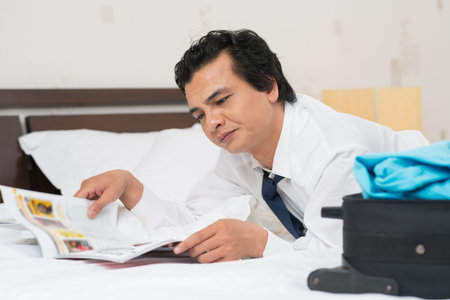 Portrait of a businessman reading newspaper