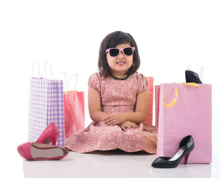 Isolated image of an upset little lady tired of shoppingの写真素材