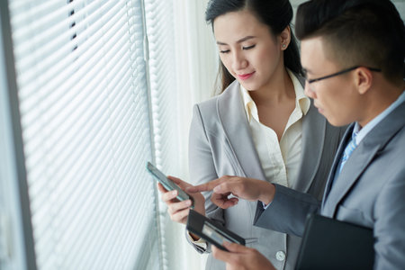 Busines people with smartphoneの写真素材