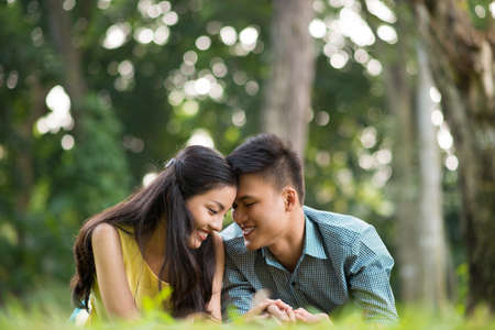 Portrait of happy teenage couple spending time outdoorsの写真素材