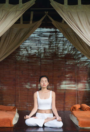 Portrait of a young meditating womanの写真素材
