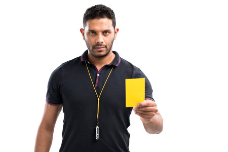 Referee showing a yellow cardの写真素材