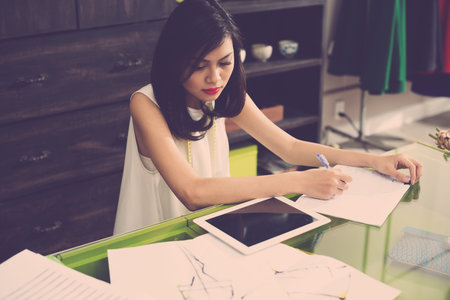 Above view of a young modern wed designer at work