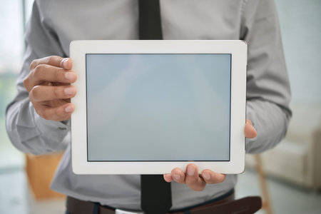 Close-up of businessman with digital tablet