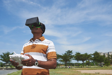 Smiling man with drone remote controller