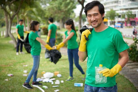 Middle-aged man with bin bagの写真素材
