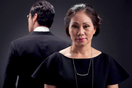 Closeup portrait of a mature adorable woman on the foregroundの写真素材