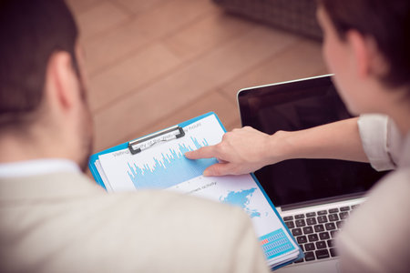 Cropped image of businesspeople analyzing the strategy of the company on the foreground