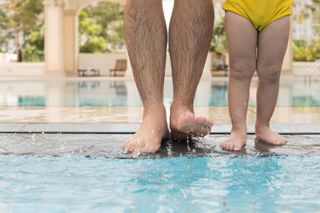 Man and little boy going to swim