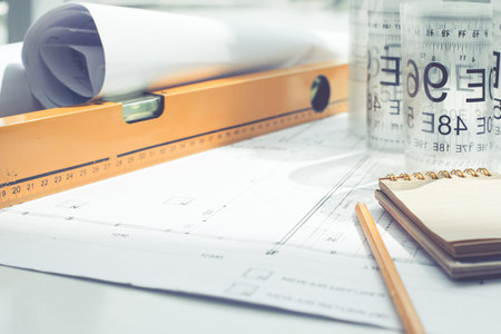 Close-up of blueprint and tools