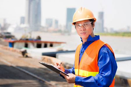 Portrait of confident inspector in the seaport
