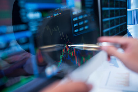 Close-up of pen pointing at the computer screen of the business broker