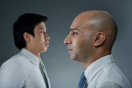 Portrait of two businessmen: multiracial business conceptの写真素材