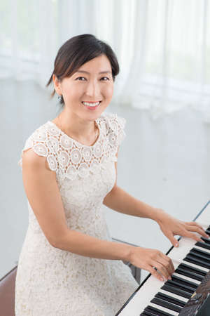 Portrait of elegant Korean female musicianの写真素材