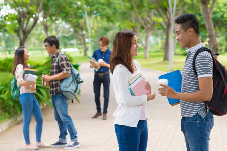 Asian college students on campus during the break