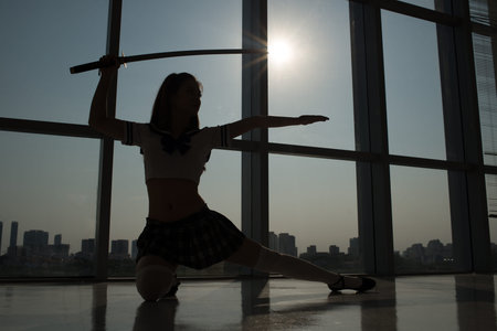 Female cosplayer exercising with katana swordの写真素材
