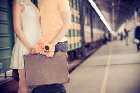 Cropped image of girl giving farewell kiss to her boyfriend at the railway stationの写真素材