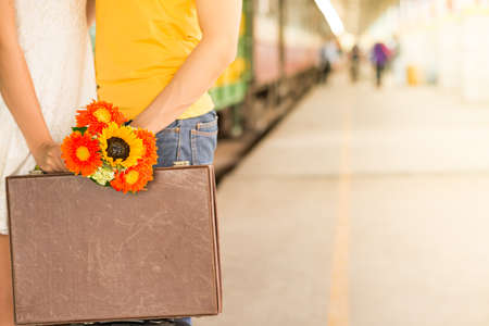 Cropped image of girl kissing her boyfriend at the train stationの写真素材