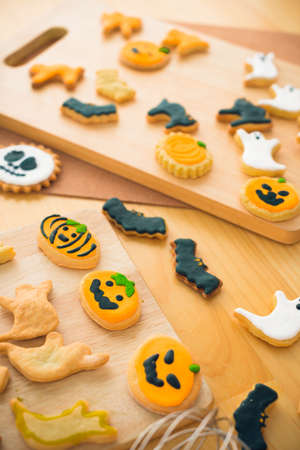 Different Halloween cookies on the table: ghosts, bats, pumpkinsの写真素材