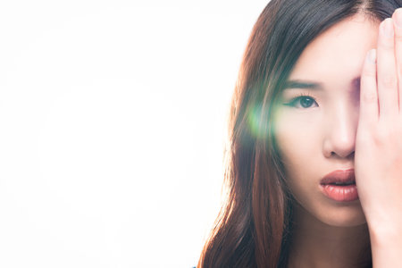 Half face of young beautiful and healthy Vietnamese womanの写真素材