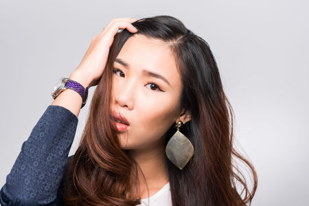 Portrait of beautiful Vietnamese woman looking at the cameraの写真素材