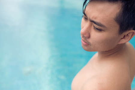 Close-up of swimmer standing in the poolの写真素材