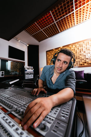 Portrait of sound technician at work in the recording studio