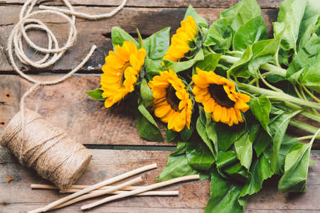 Sunflowers on wooden planksの写真素材