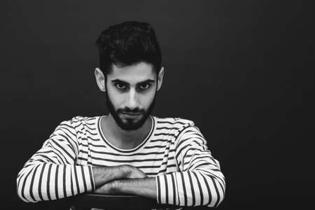 Black and white portrait of attractive bearded man looking at the cameraの写真素材