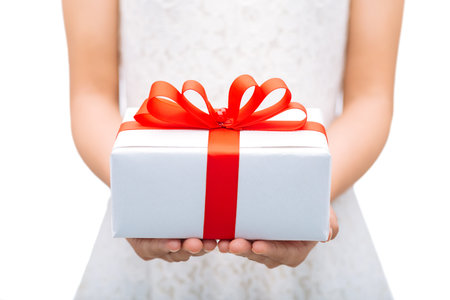 Female hands holding gift box