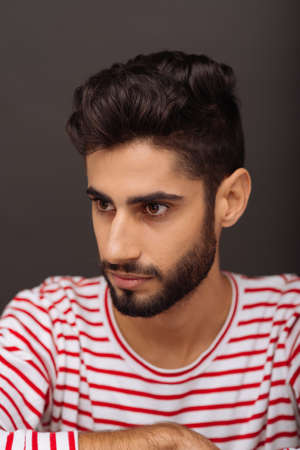 Portrait of handsome young man with fashionable hairstyleの写真素材