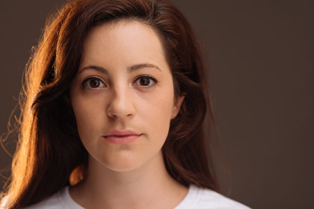 Face of beautiful brunette looking at the cameraの写真素材