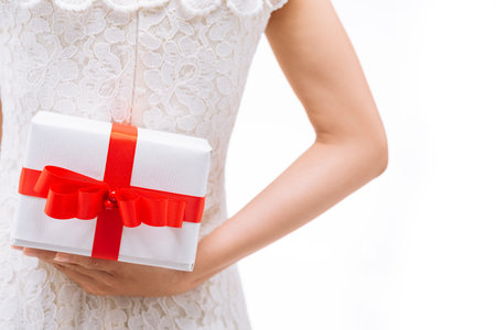 Cropped image of girl holding a birthday presentの写真素材