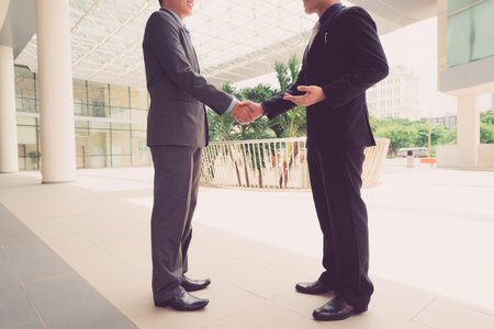 Unrecognizable business partner shaking handsの写真素材