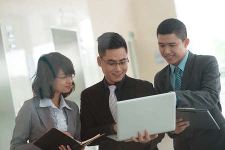 Business people with laptop planning their workの写真素材