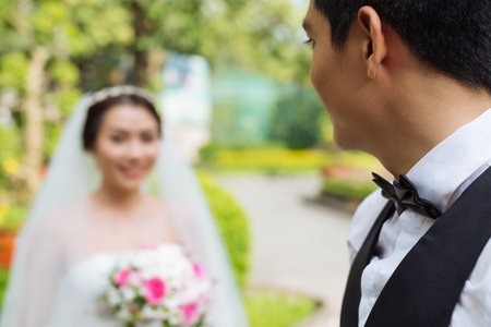 Happy groom looking at his brideの写真素材