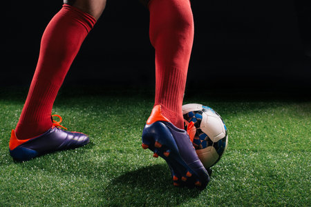 Legs of soccer player dribbling the ballの写真素材
