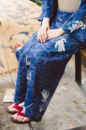 Cropped image of woman wearing Japanese kimono and geta shoesの写真素材