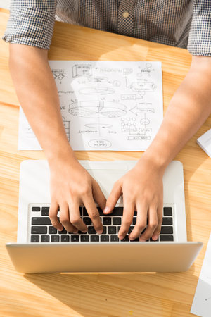 Businessman working on laptop, view from the top