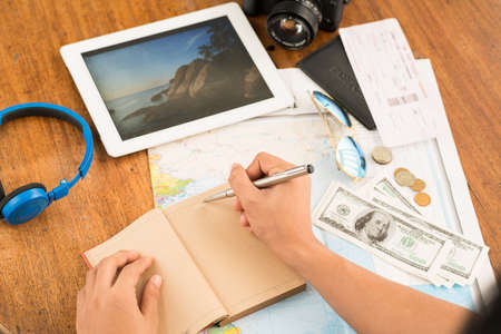 Hands of man planning his vacationsの写真素材