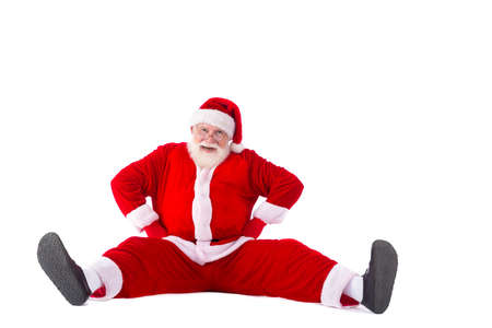 Smiling funny Santa sitting on the floorの写真素材