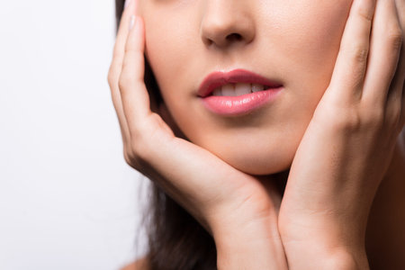 Cropped image of young woman with beautiful lips