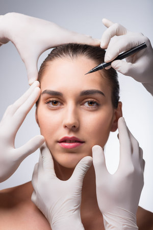 Portrait of young woman before marking her face for liftingの写真素材