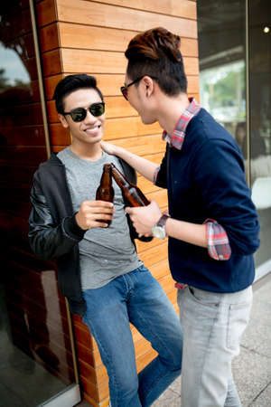Friends chilling out outdoorsの写真素材
