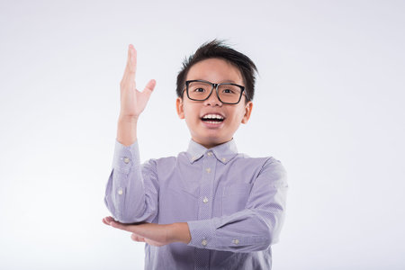 Vietnamese schoolboy raising his hand