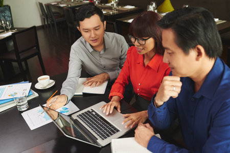 Gathered at laptopの写真素材