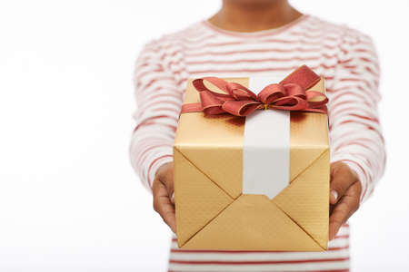 Man giving you big giftbox, selective focusの写真素材