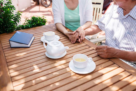Woman vising father in retirement homeの写真素材