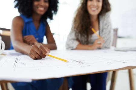 Female architects discussing details of the building project, selective focusの写真素材