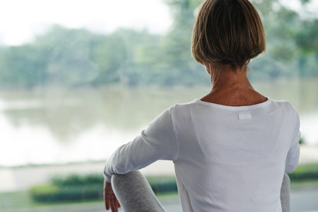 Close-up image of mature woman practicing yoga at homeの写真素材